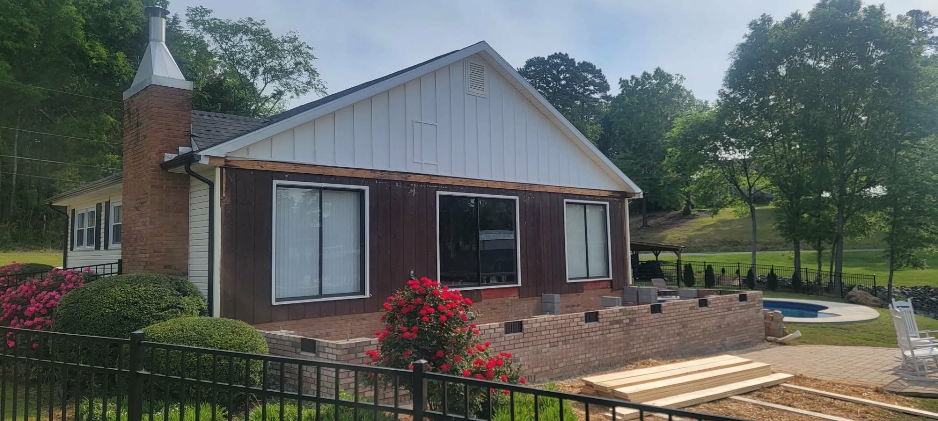 Home remodel with new board-and-batten siding and chimney work