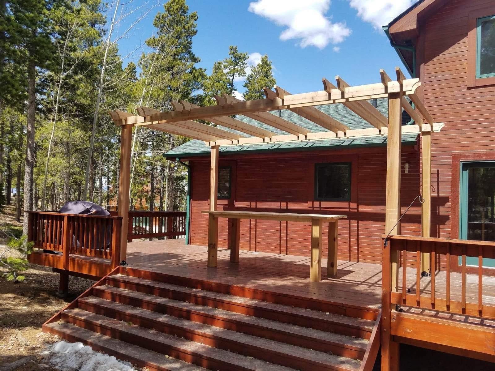 Cedar pergola over redwood deck at mountain cabin